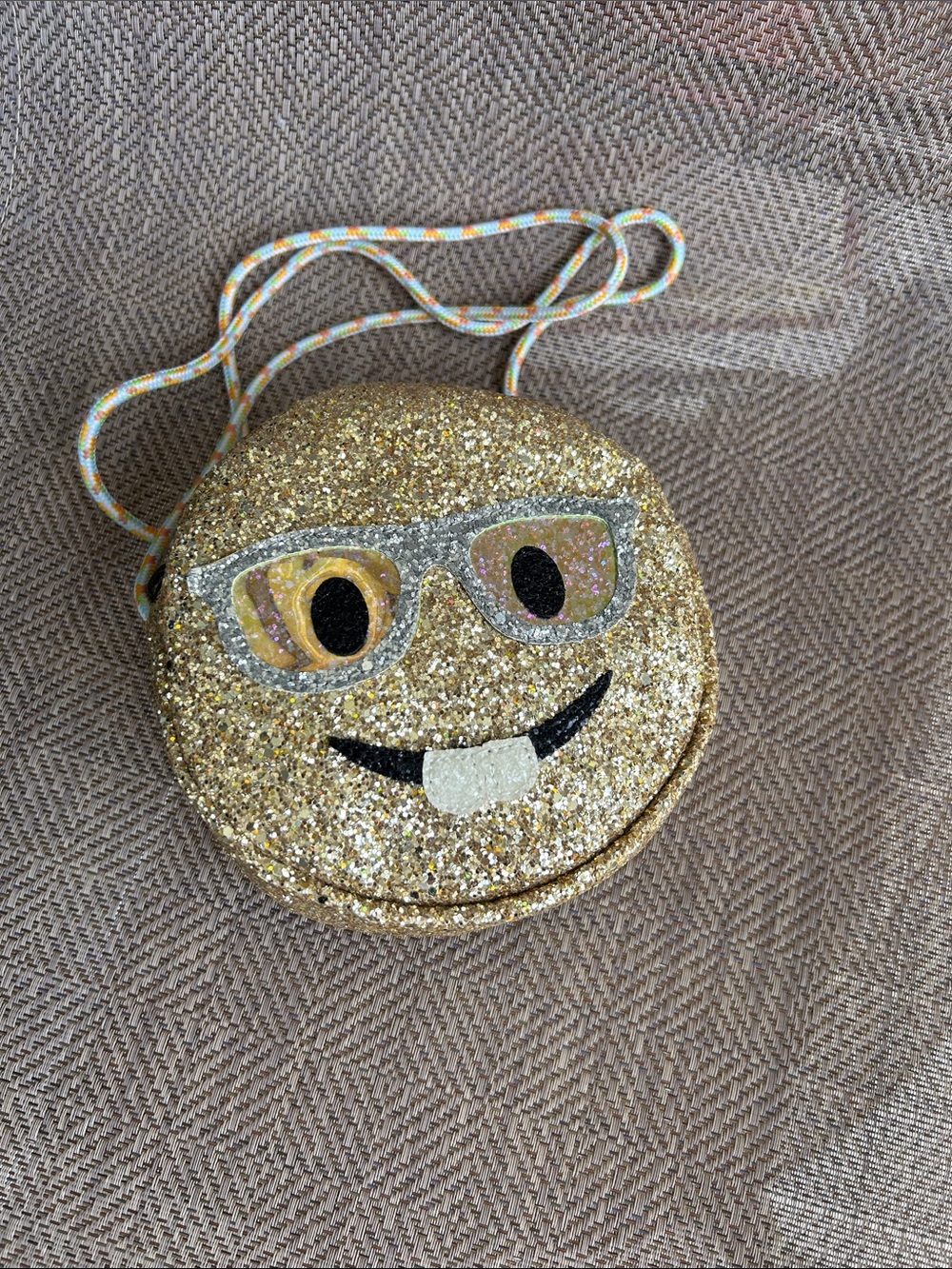Crewcuts Gold Glitter Emoji with buckteeth Crossbody Bag with Multicolor Cord.